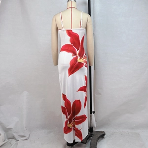 Detailed back view of a white floral sundress featuring red lilies and adjustable straps