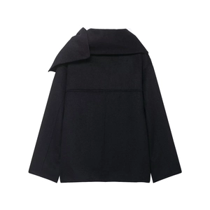 Macro shot of asymmetric wide lapel and stitching on black wool blend short coat