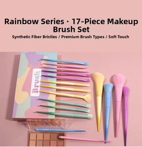 Close-up of 17 macaron-colored makeup brushes with rainbow handles and soft fiber bristles