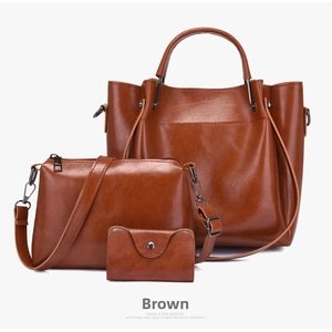 Detailed view of the 3-in-1 brown synthetic leather tote set with metallic hardware