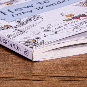 How to Draw Inky Wonderlands coloring book for adults on dark wood background