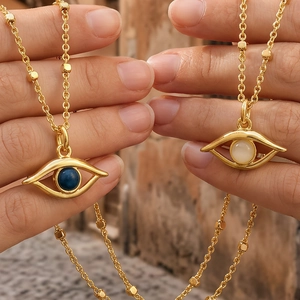 Bohemian 18K gold plated evil eye pendant necklace featuring blue and white resin stones