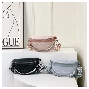 Three half-moon crossbody bags with pearl chains and geometric patterned woven straps