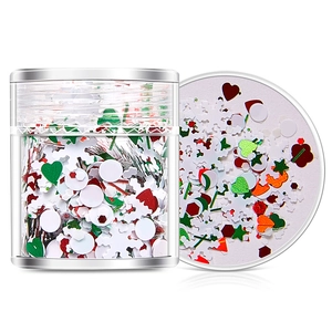 Christmas nail art sequins mix with snowflakes, stars, and glitter in a clear jar