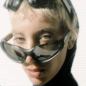 Y2K millennium style black sunglasses with silver mirrored lenses in cyberpunk aesthetic