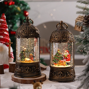 Vintage gold birdcage Christmas music box with snow globe scene and spinning glitter