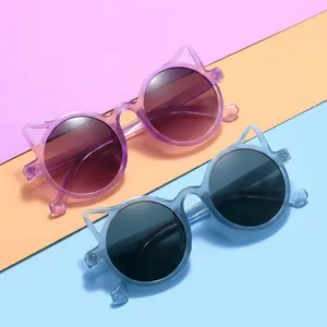 Close-up of pink and blue cat ear children's sunglasses with dark protective lenses
