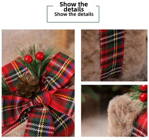 Macro view of Christmas gift box decor with faux fur, plaid ribbon and pine needles