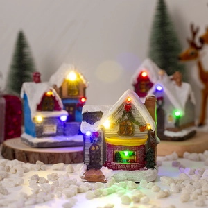 Lighted Christmas village house with LED lights and festive miniature decor