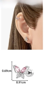 Detailed macro view of silver butterfly cartilage stud with pink marquise stones