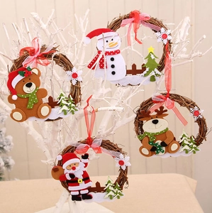 Detail of Christmas rattan wreaths featuring Santa, snowman, elk, and bear fabric characters