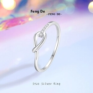 Detail of S925 sterling silver ring showing the knot design and fine cubic zirconia stones