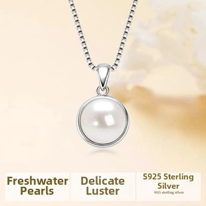 Close-up of a high-luster round freshwater pearl pendant on a S925 sterling silver chain