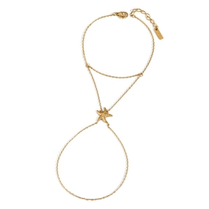Minimalist gold starfish hand chain bracelet ring featuring a polished sea star charm