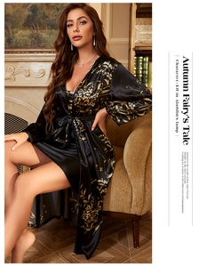 Close-up of black satin floral print nightgown set with luxurious glossy texture