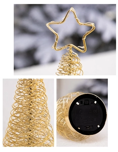 Detail of gold metal wire Christmas tree with LED star topper and battery base