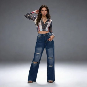 Detail of high-waisted distressed wide-leg jeans with ripped accents and frayed hems