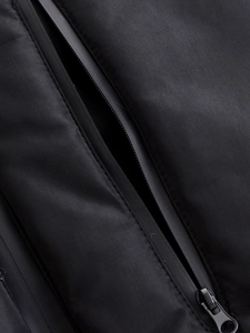 Close-up of a durable black waterproof zipper on tactical urban functional jacket