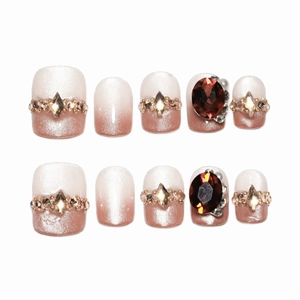 Short brown cat-eye gradient press-on nails with sparkling rhinestones and large gemstones