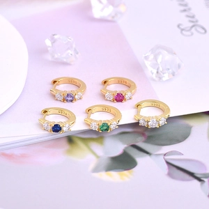 Detailed macro view of S925 sterling silver hoop earrings with colorful zircon stones
