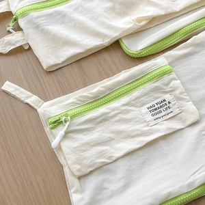 Bolsa de almacenamiento de viaje en nylon blanco con cremallera verde neón y asa lateral