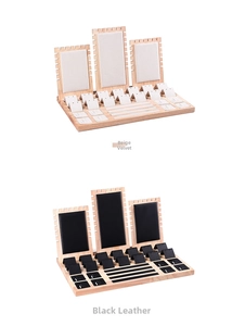 Jewelry display set with beige velvet and black leather options on wooden bases