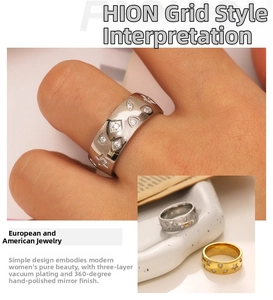 Detail of 18k gold plated ring with star engravings and polished mirror finish