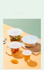 Detail showing various sizes of food-grade silicone lids sealing bowls and measuring cups