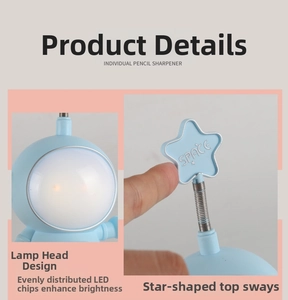 Detail view of cartoon astronaut LED desk lamp featuring flexible star-shaped spring antenna