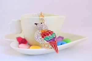 Detail shot of colorful enamel kingfisher bird keychain with sparkling crystal rhinestones