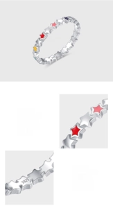 Detail of S925 sterling silver ring featuring colorful enamel stars and polished finish