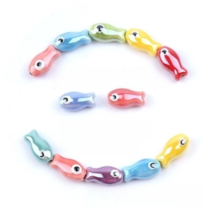 Detail of 10x19mm fish shaped ceramic beads showing 2.5mm hole for DIY jewelry making