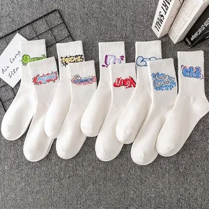 White crew socks set with colorful graffiti lettering in American retro street style