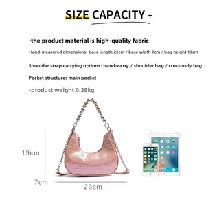 Pink crescent underarm bag with crocodile texture and metal ball strap detail