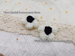 Close-up of handmade crochet milk cotton flowers for DIY accessories and hair decor