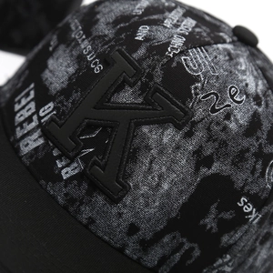 Macro shot of 3D embroidered K logo and graffiti print on the stylish flat brim hip hop cap