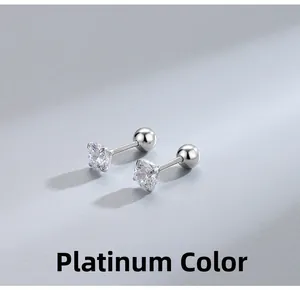 Close-up of S925 sterling silver four-prong stud earrings with screw backs in white gold