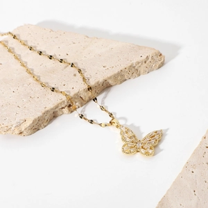 18K gold plated butterfly necklace with white cubic zirconia crystals on stone base