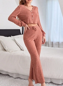 Detailed view of rib-knit fabric texture on long sleeve pajamas with button closure