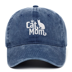 Close-up of Cat Mom embroidery on a vintage washed navy blue denim baseball cap