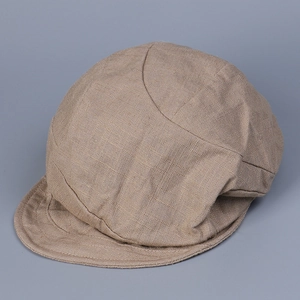 Close-up of khaki linen duckbill cap showing detailed breathable fabric texture