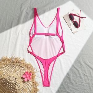 Detail view of pink backless swimsuit with adjustable straps and high-cut leg