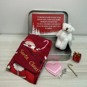 Christmas bear gift set with metal tin white plush bear santa sack and card