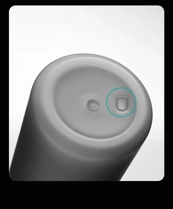 Macro shot of matte grey water bottle base with non-slip design and positioning slot