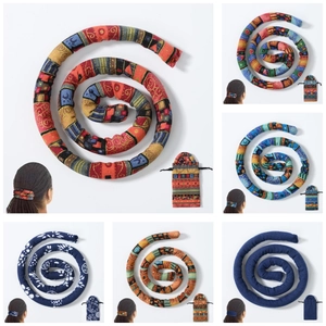 Detail view of multi-color ethnic style bendable spiral hair ties for dreadlocks and ponytails