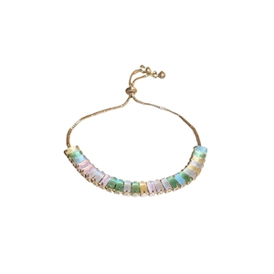 Minimalist gold bracelet with colorful rectangular zircons and adjustable sliding clasp