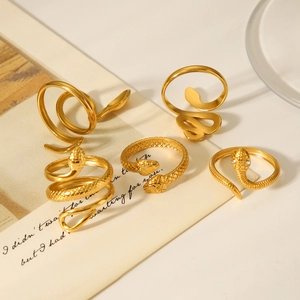 Detail of five 18K gold plated stainless steel snake rings with sparkling zircon accents