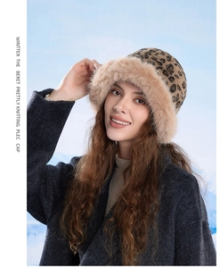 Close-up of leopard print knit bucket hat with soft faux fur trim for winter