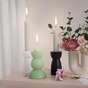 Modern geometric ceramic candle holders in white, mint green and black for home decor