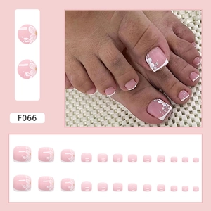 Pink press-on toenails with white flower designs and French tips, 24-piece kit F066